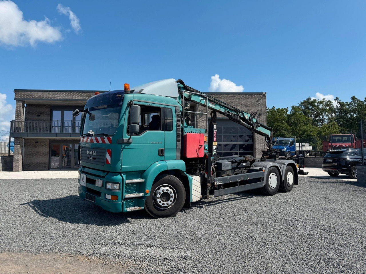 Camion ampliroll MAN TGA 26.360 Kran TeRex Multilift Fernbedienung
