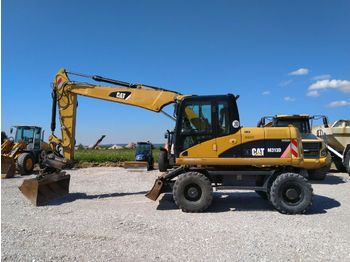 Pelle sur pneus CAT M313D *Oilquick OQ65