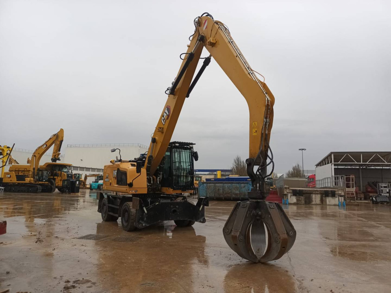 Pelle sur pneus CAT MH3024-1