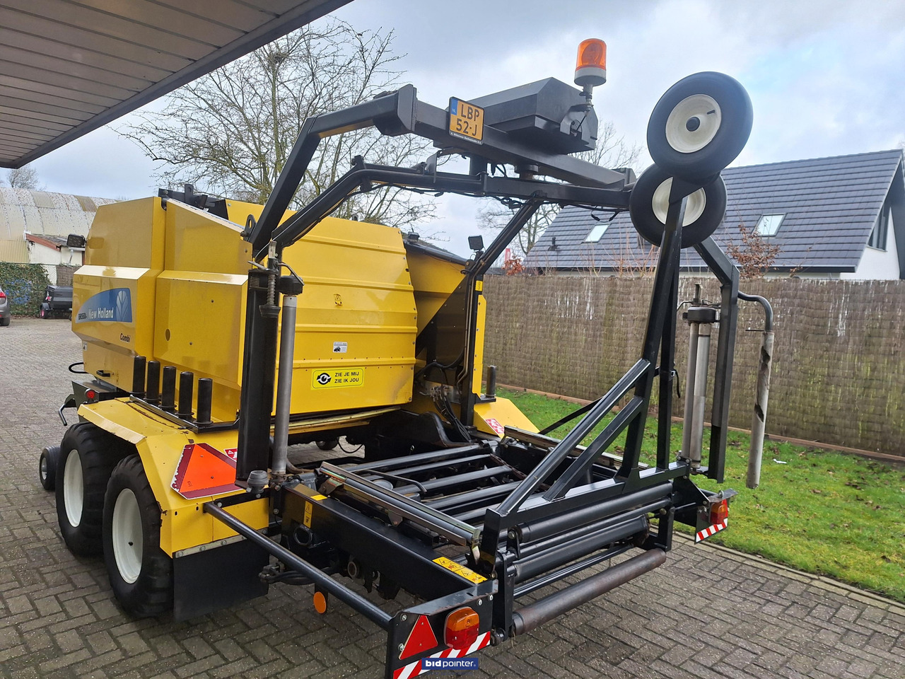 Presse à balles rondes New Holland BR560A pers wikkel combinatie