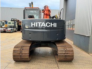 Pelle sur chenille Hitachi ZX135US: photos 4
