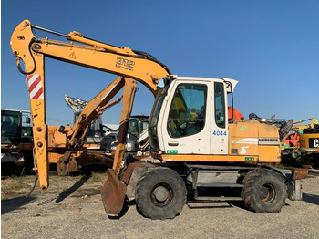 Pelle sur pneus Liebherr A 312: photos 2