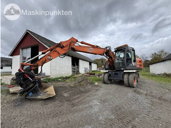Pelle sur pneus HITACHI ZX140W-3