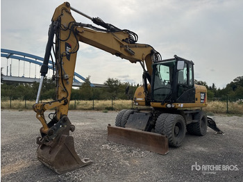 Pelle sur pneus CATERPILLAR M313D