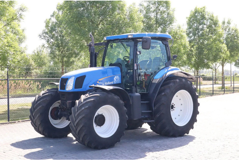 New Holland TS135A | 40 KM/H | 4X4 | SUPERSTEER - Tracteur agricole: photos 1 New Holland TS135A | 40 KM/H | 4X4 | SUPERSTEER - Tracteur agricole: photos 1