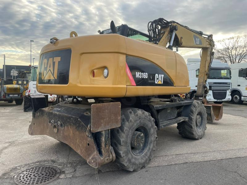Caterpillar M316 - Pelle sur pneus: photos 4 Caterpillar M316 - Pelle sur pneus: photos 4