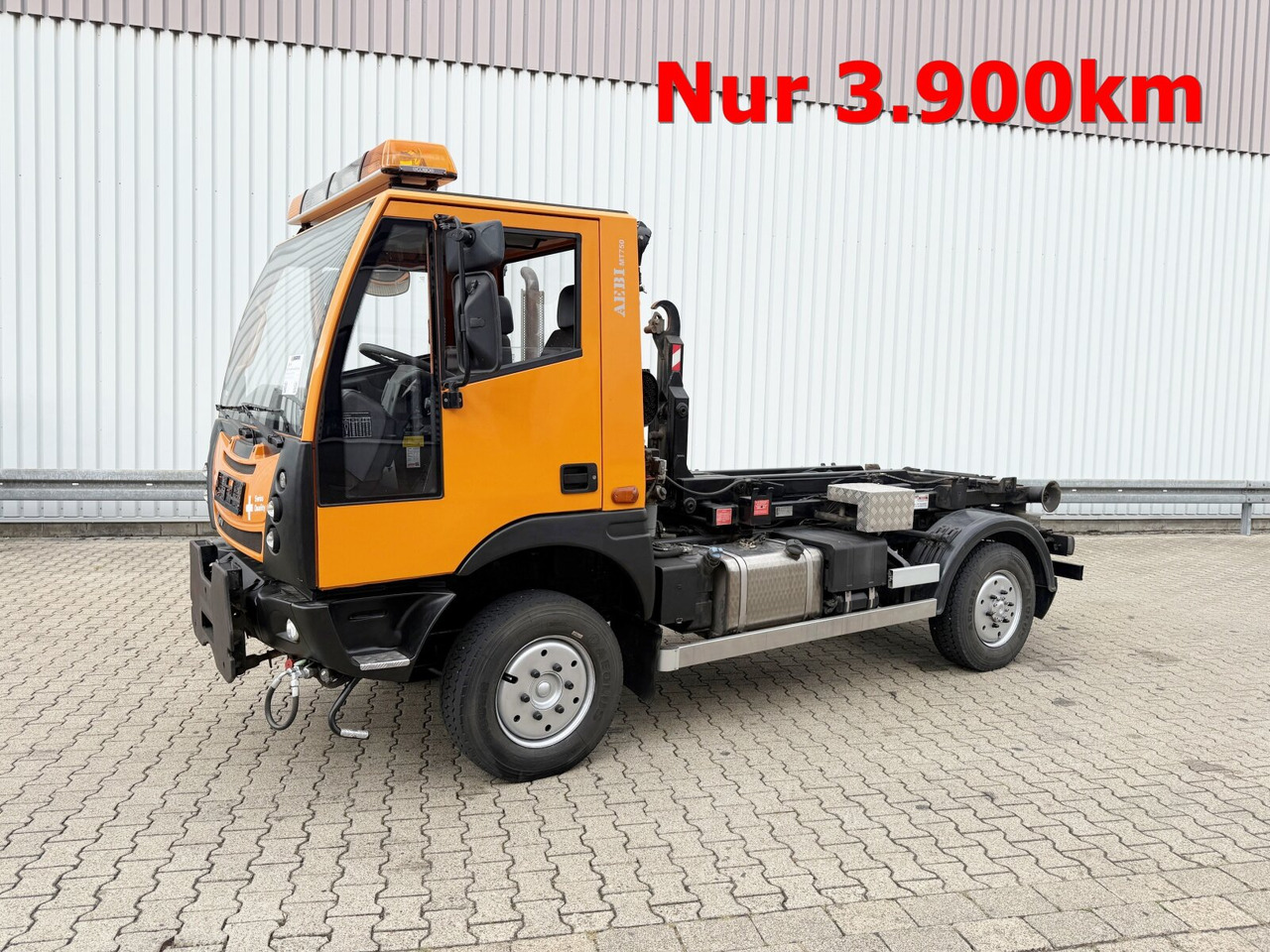 AEBI Schmidt MT750 4x4 AEBI Schmidt MT750 4x4, City-Abroller, Winterdienstausstattung, 2x AHK - Camion ampliroll: photos 1 AEBI Schmidt MT750 4x4 AEBI Schmidt MT750 4x4, City-Abroller, Winterdienstausstattung, 2x AHK - Camion ampliroll: photos 1