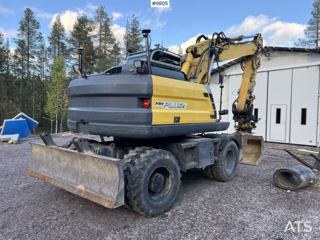 New Holland, MH-Plus-C Wheel excavator with excavation system, rotor, and grader bucket - Pelle sur pneus: photos 4 New Holland, MH-Plus-C Wheel excavator with excavation system, rotor, and grader bucket - Pelle sur pneus: photos 4