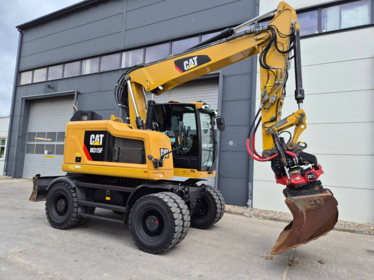 CAT M315F - Pelle sur pneus: photos 2 CAT M315F - Pelle sur pneus: photos 2