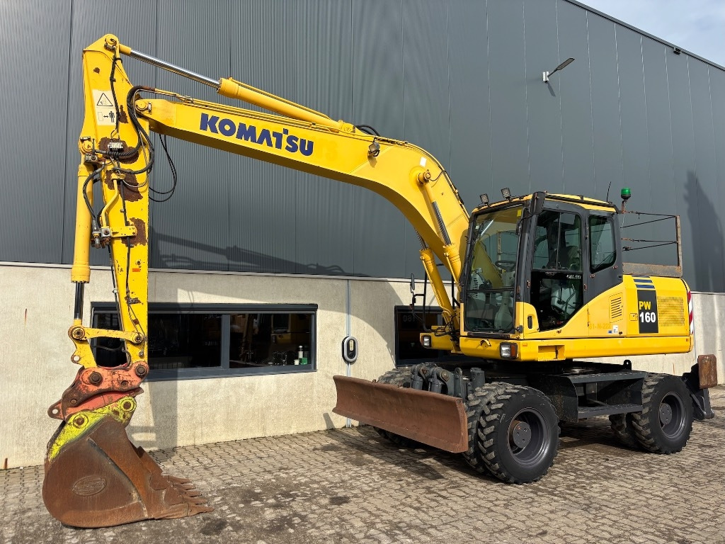 Komatsu PW 160-7 - PW160 - PW 160 - PW 180 - PW 140 - Pelle sur pneus: photos 1 Komatsu PW 160-7 - PW160 - PW 160 - PW 180 - PW 140 - Pelle sur pneus: photos 1
