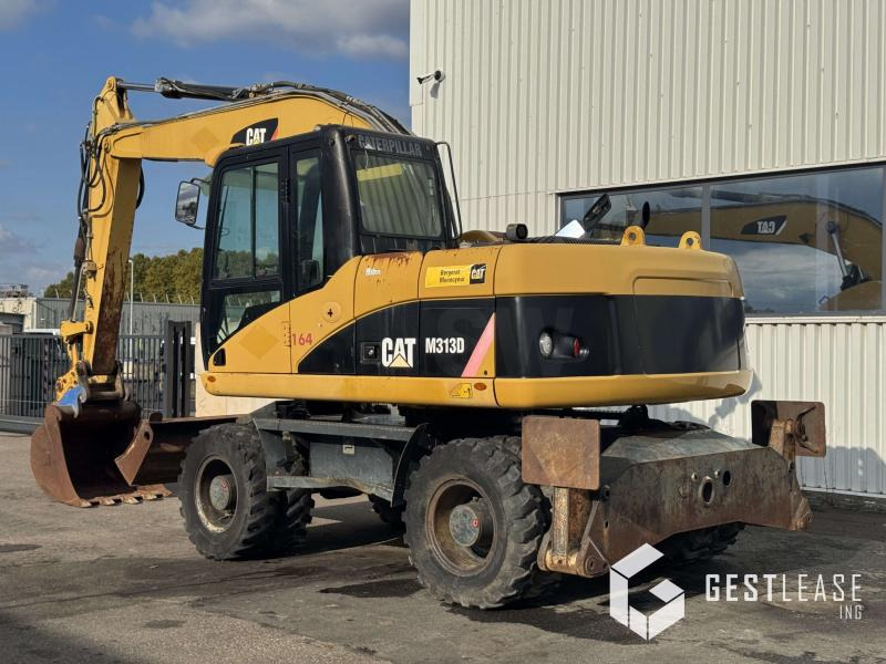 Caterpillar M313D - Pelle sur pneus: photos 2 Caterpillar M313D - Pelle sur pneus: photos 2