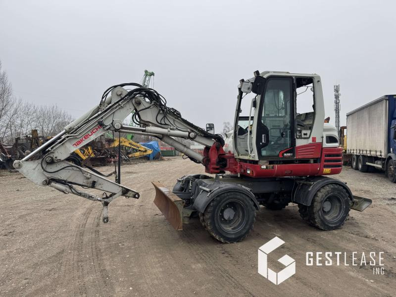 Takeuchi TB295W - Pelle sur pneus: photos 1 Takeuchi TB295W - Pelle sur pneus: photos 1