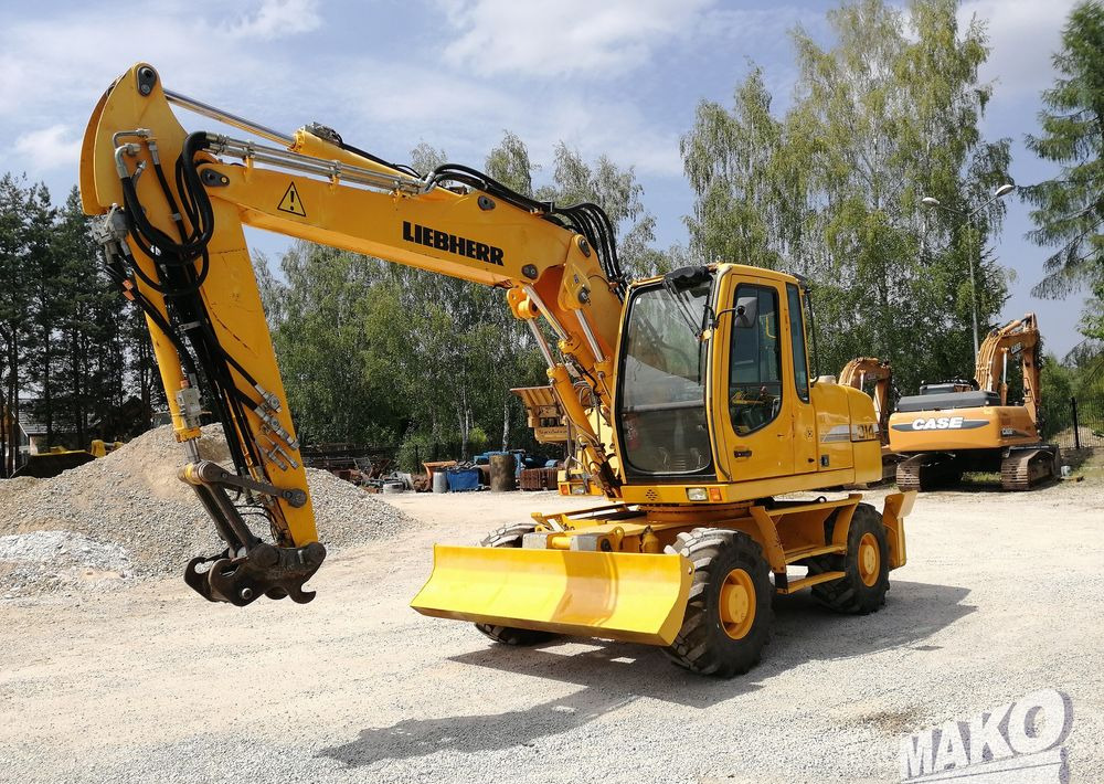 Liebherr A 314 Litronic - Pelle sur pneus: photos 1 Liebherr A 314 Litronic - Pelle sur pneus: photos 1