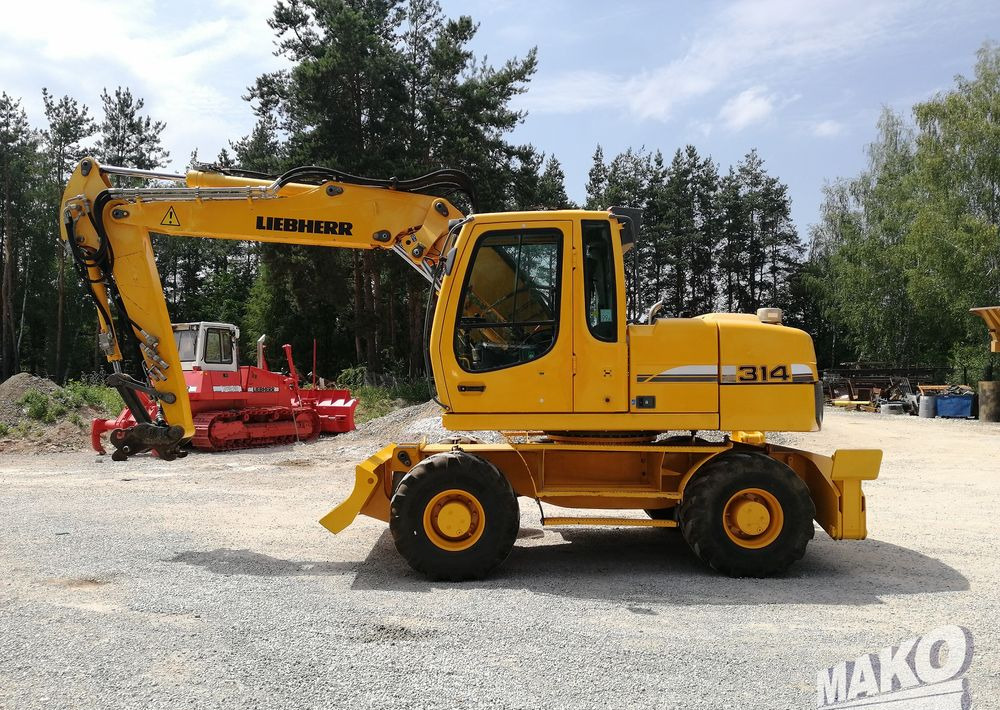 Liebherr A 314 Litronic - Pelle sur pneus: photos 2 Liebherr A 314 Litronic - Pelle sur pneus: photos 2