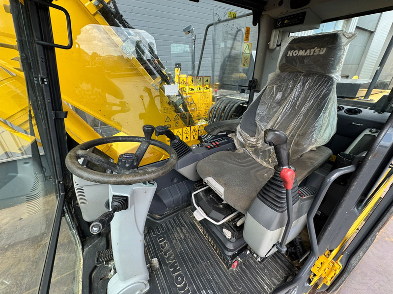 Pelle sur pneus Komatsu PW180-11: photos 8