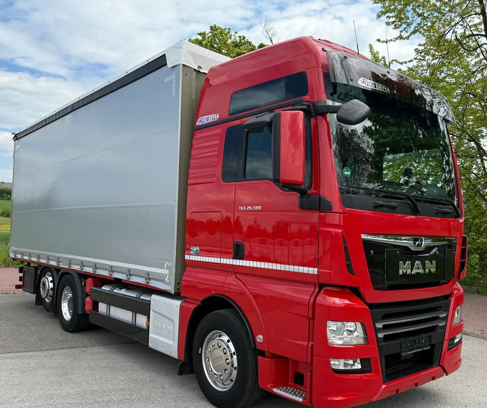 MAN TGX 26.500/LIFT/6X2/KLIMA POSTOJOWA/18PALET/E6/FIRANKA/WINDA/NISKI PRZEBIEG/JEDEN WŁAŚCICIEL/PODWIESZANA OŚ - Camion à rideaux coulissants: photos 1 MAN TGX 26.500/LIFT/6X2/KLIMA POSTOJOWA/18PALET/E6/FIRANKA/WINDA/NISKI PRZEBIEG/JEDEN WŁAŚCICIEL/PODWIESZANA OŚ - Camion à rideaux coulissants: photos 1