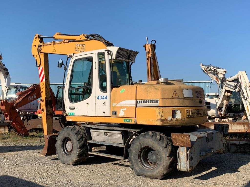 Liebherr A 312 - Pelle sur pneus: photos 3 Liebherr A 312 - Pelle sur pneus: photos 3