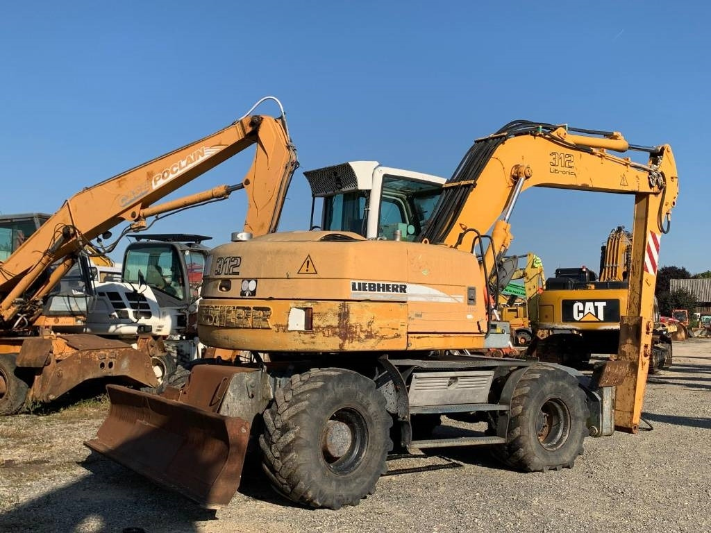 Pelle sur pneus Liebherr A 312: photos 7