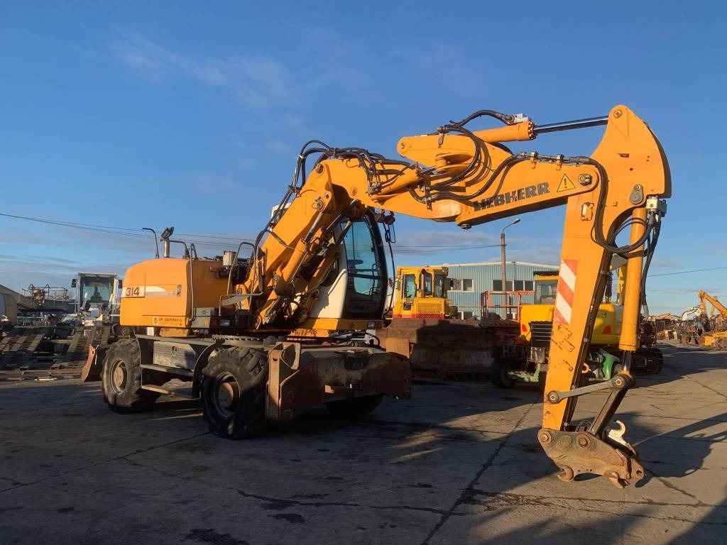 Liebherr A 314 Litronic - Pelle sur pneus: photos 5 Liebherr A 314 Litronic - Pelle sur pneus: photos 5