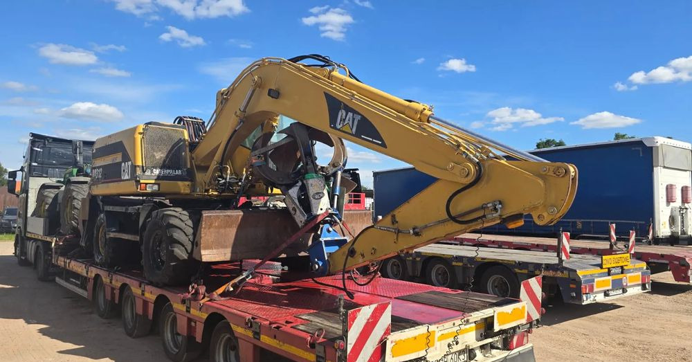 Caterpillar M312 - Pelle sur pneus: photos 1 Caterpillar M312 - Pelle sur pneus: photos 1