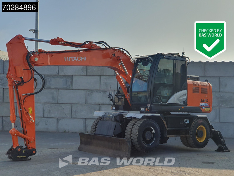 Hitachi ZX140W -6 OUTRIGGERS + BLADE - Pelle sur pneus: photos 1 Hitachi ZX140W -6 OUTRIGGERS + BLADE - Pelle sur pneus: photos 1