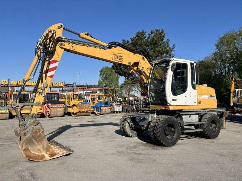 Liebherr A312 Litronic - Pelle sur pneus: photos 3 Liebherr A312 Litronic - Pelle sur pneus: photos 3