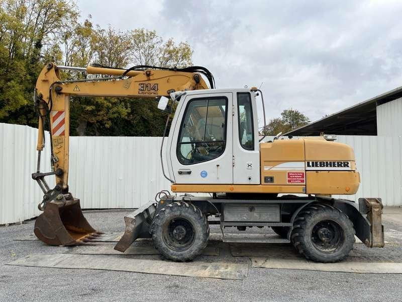Liebherr A314 Litronic - Pelle sur pneus: photos 3 Liebherr A314 Litronic - Pelle sur pneus: photos 3