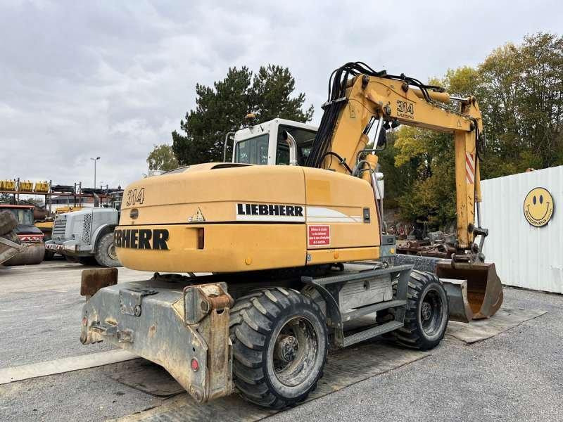 Liebherr A314 Litronic - Pelle sur pneus: photos 5 Liebherr A314 Litronic - Pelle sur pneus: photos 5