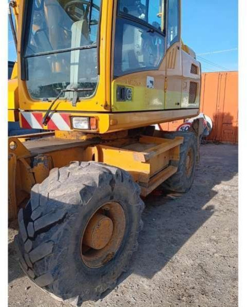 Volvo EW140D - Pelle sur pneus: photos 4 Volvo EW140D - Pelle sur pneus: photos 4