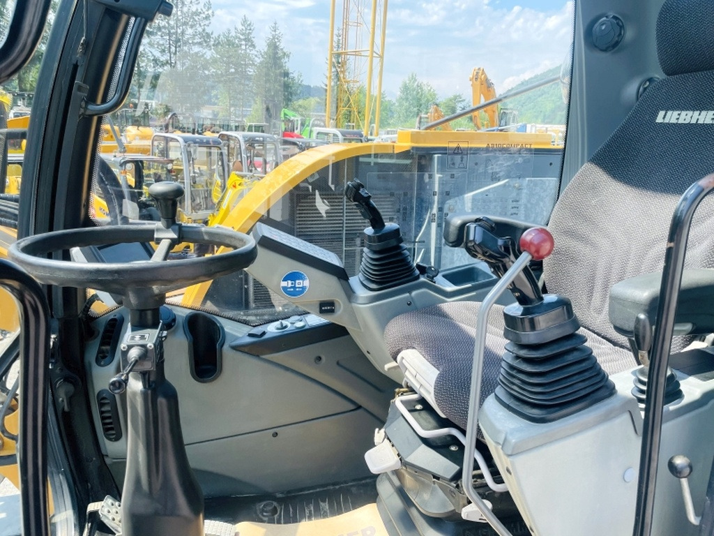 Liebherr A910 Compact (4025) - Pelle sur pneus: photos 5 Liebherr A910 Compact (4025) - Pelle sur pneus: photos 5