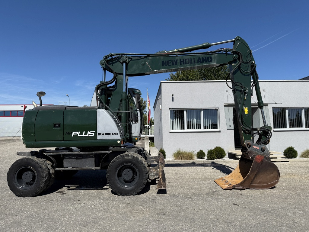 New Holland MH-Plus (111695) - Pelle sur pneus: photos 5 New Holland MH-Plus (111695) - Pelle sur pneus: photos 5