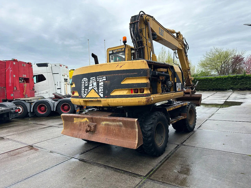 Pelle sur pneus Caterpillar M315 +ROTO CE: photos 6