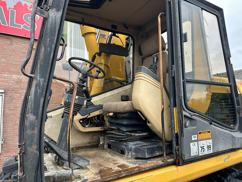 Pelle sur pneus Caterpillar M315 +ROTO CE: photos 11