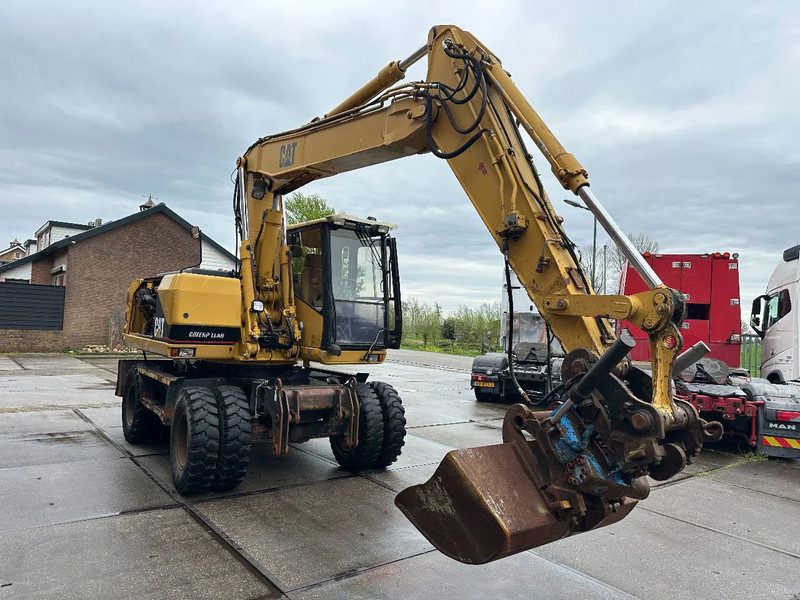 Caterpillar M315 +ROTO CE - Pelle sur pneus: photos 3 Caterpillar M315 +ROTO CE - Pelle sur pneus: photos 3