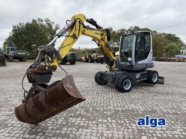 Neuson EW65, Verstellausleger, Hydr. S.W.S.,Div. Löffel - Pelle sur pneus: photos 1 Neuson EW65, Verstellausleger, Hydr. S.W.S.,Div. Löffel - Pelle sur pneus: photos 1