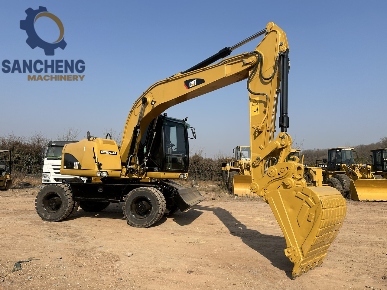 CATERPILLAR M320D2 - Pelle sur pneus: photos 1 CATERPILLAR M320D2 - Pelle sur pneus: photos 1