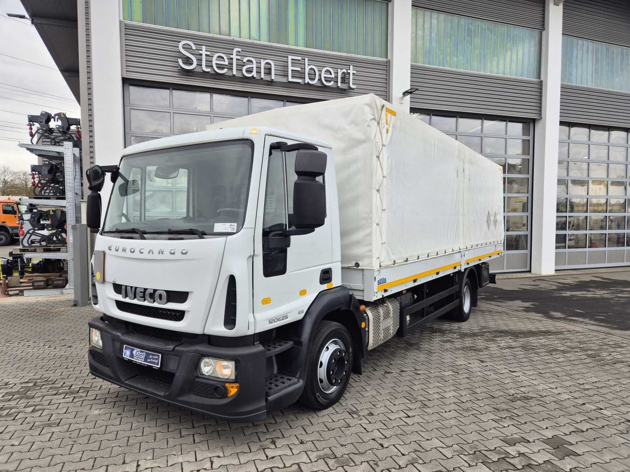 Iveco Eurocargo ML120E25 4x2 AHK Differenzial - Camion à rideaux coulissants: photos 1 Iveco Eurocargo ML120E25 4x2 AHK Differenzial - Camion à rideaux coulissants: photos 1