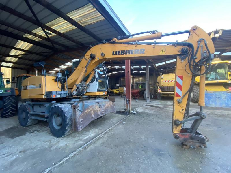 Liebherr A314 Litronic - Pelle sur pneus: photos 1 Liebherr A314 Litronic - Pelle sur pneus: photos 1