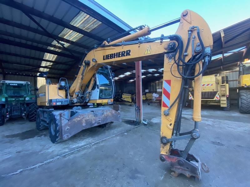 Liebherr A314 Litronic - Pelle sur pneus: photos 1 Liebherr A314 Litronic - Pelle sur pneus: photos 1