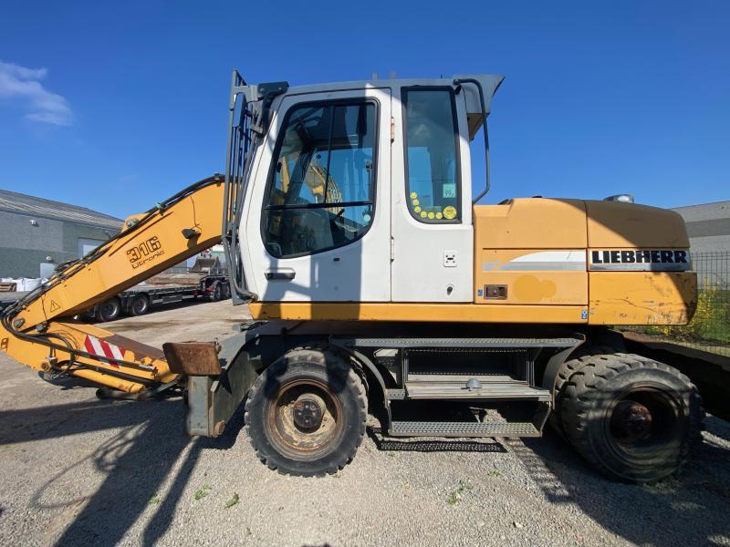 Liebherr A316Litronic - Pelle sur pneus: photos 1 Liebherr A316Litronic - Pelle sur pneus: photos 1
