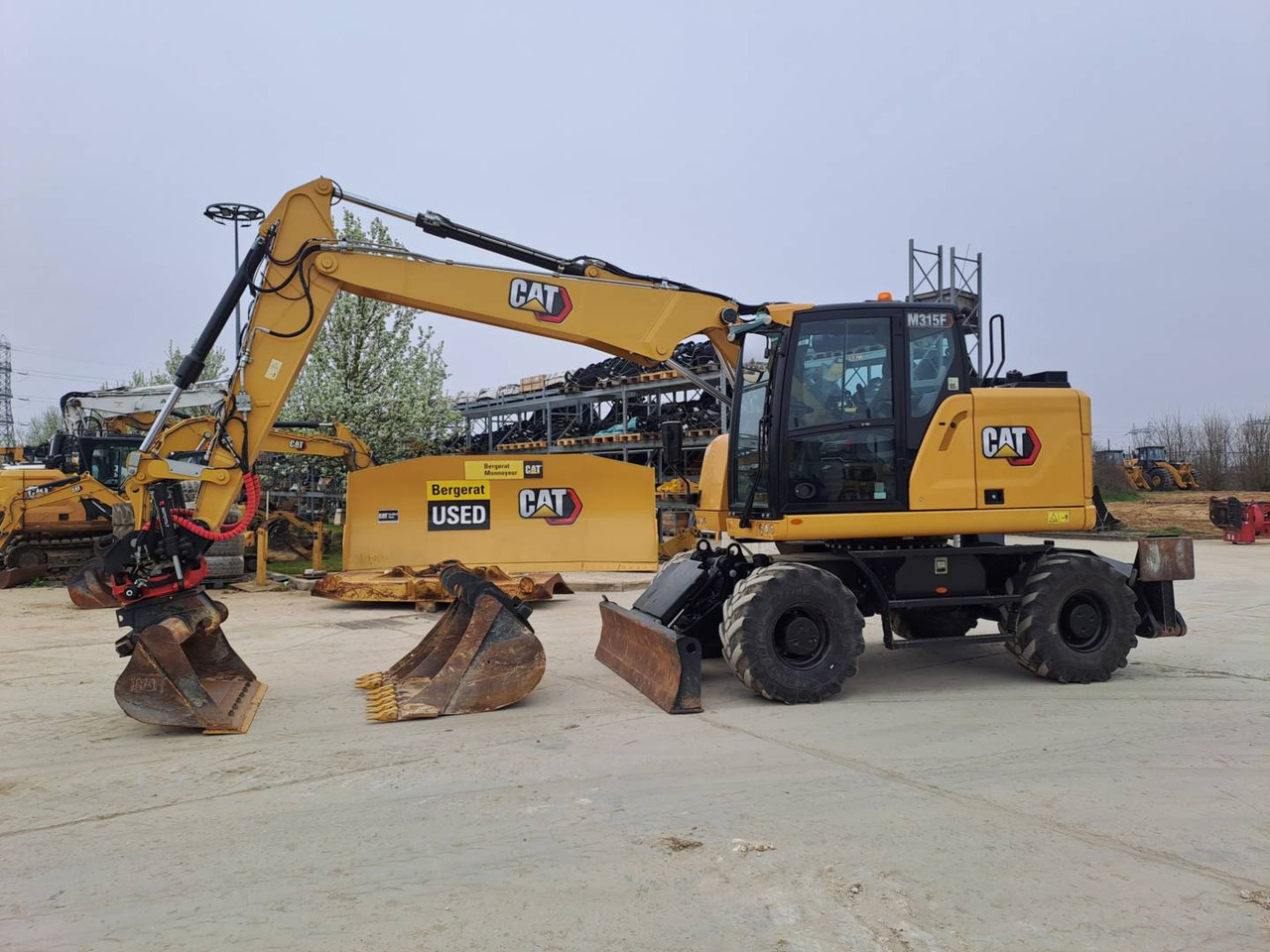 CAT M315F IVC - Pelle sur pneus: photos 1 CAT M315F IVC - Pelle sur pneus: photos 1