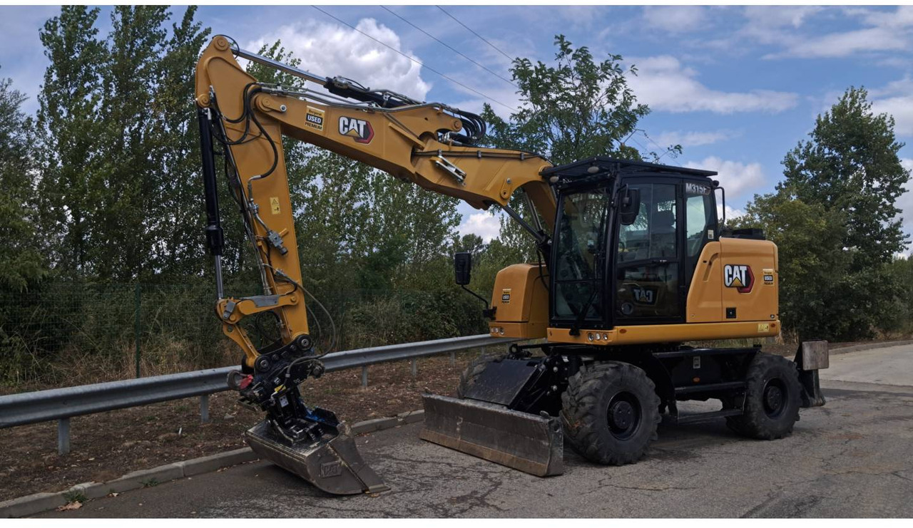 CAT M315F IVC - Pelle sur pneus: photos 1 CAT M315F IVC - Pelle sur pneus: photos 1