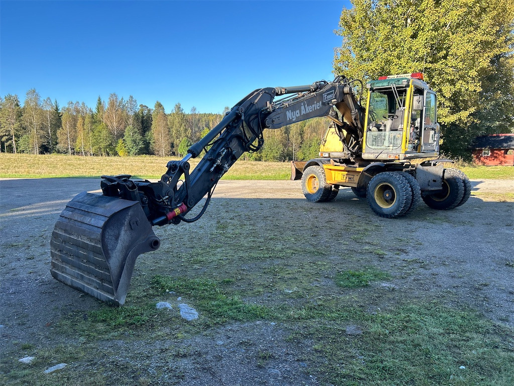 Volvo EW140B - Pelle sur pneus: photos 1 Volvo EW140B - Pelle sur pneus: photos 1