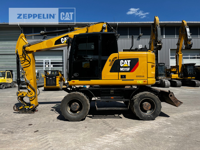Cat M315F - Pelle sur pneus: photos 1 Cat M315F - Pelle sur pneus: photos 1