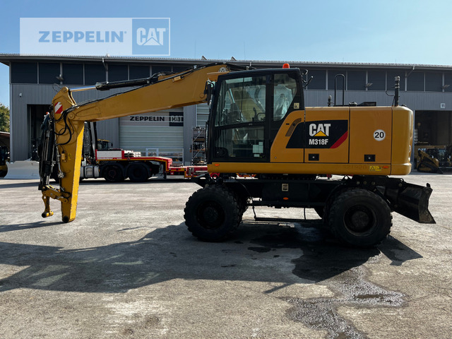Cat M318F - Pelle sur pneus: photos 1 Cat M318F - Pelle sur pneus: photos 1